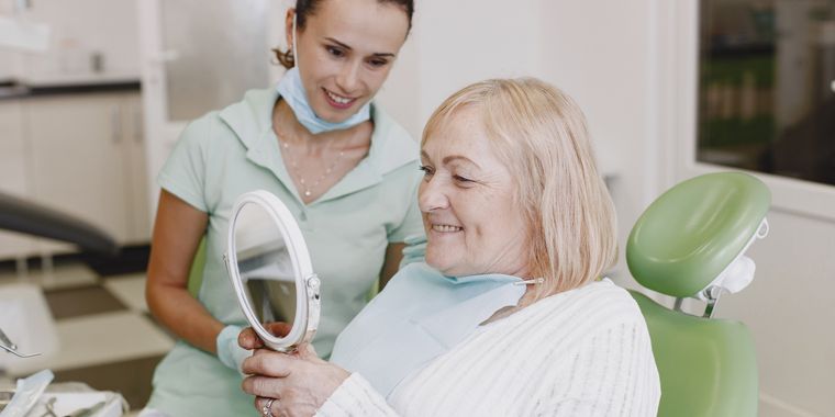 Older woman smiling at the dentist