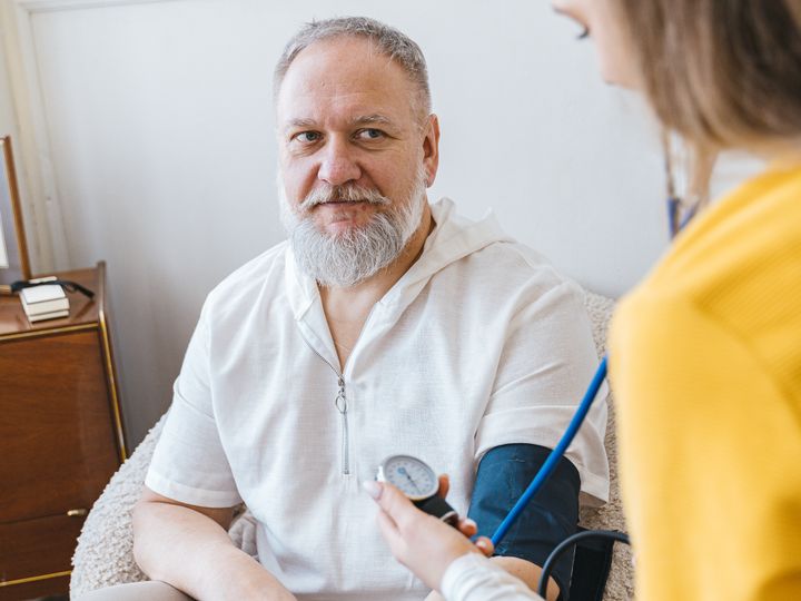 Older man having his blood pressure taken