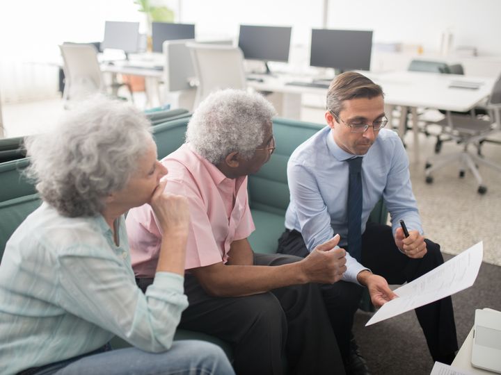 Advisor explaining options to an older couple
