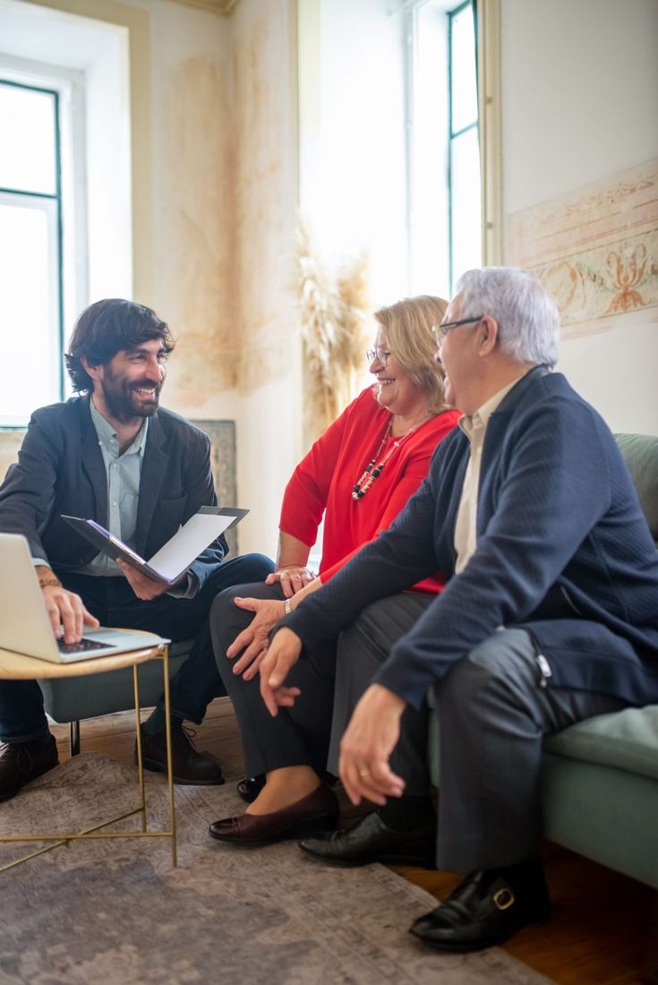 Insurance agent talking with an older couple