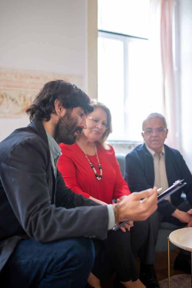 Agent reviewing documents with an older couple
